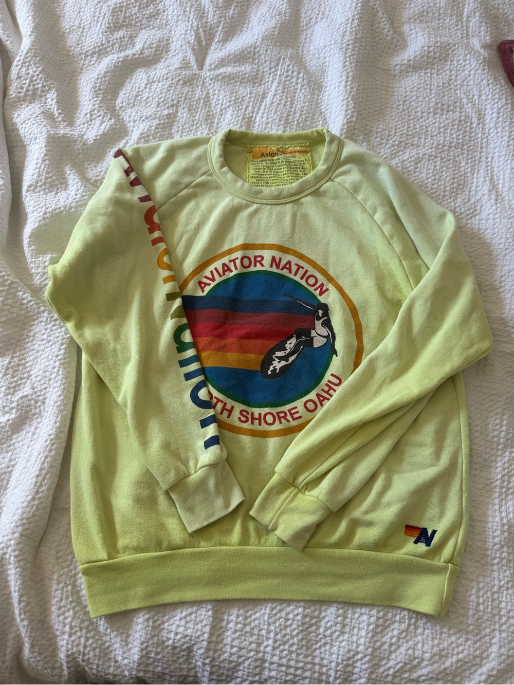 Aviator Nation women’s Yellow Crewneck with Rainbow South Shore Oahu Graphic